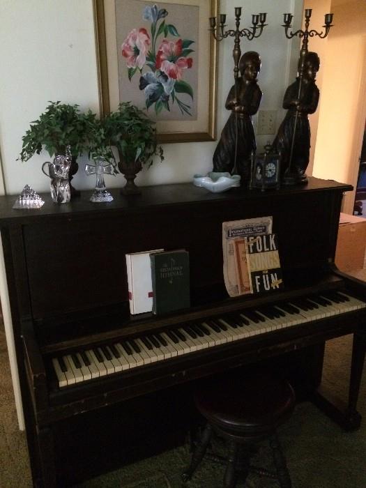 Monarch upright piano;  music books; antique piano stool