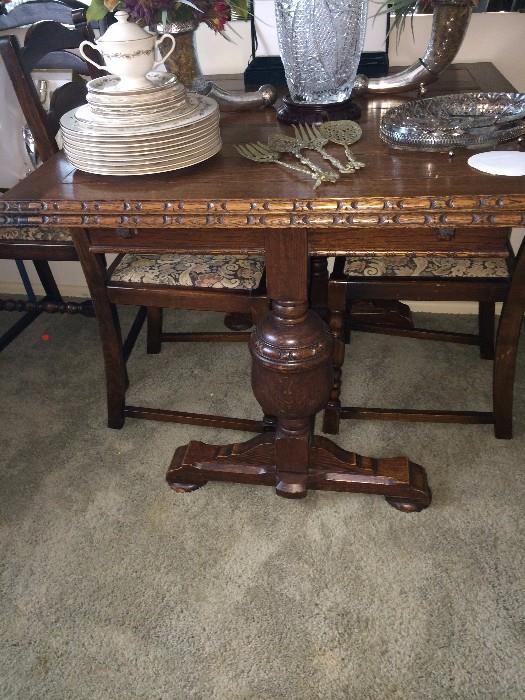          Antique draw leaf table with 4 chairs