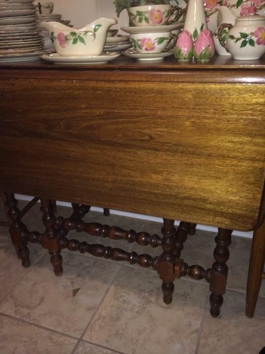  Antique drop leaf table; variety of Desert Rose pottery