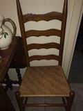 One of four ladder back chairs