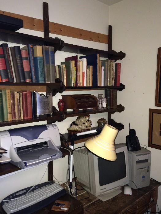 Keyboard, printer, monitor, desk lamp, and more books