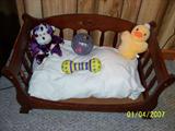 Cute wood dog bed.