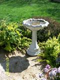 Heavy cement bird bath.