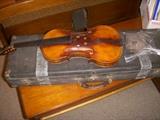Violin "project" with the pieces in the plastic bag. Includes case and bow