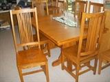 Lovely oak dining table with 3 leaves and 6 chairs in the Frank Lloyd Wright style, but no label found