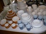 Assorted sets of dishes. All white set toward back is Franciscan