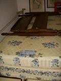 Twin beds (pair) but only one headboard/footboard wooden frame. The other set is on a simple metal frame