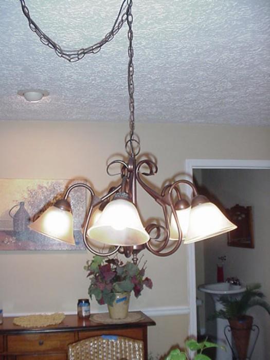 Chandelier over kitchen table