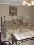 Metal king-size bed with mattress and boxsprings