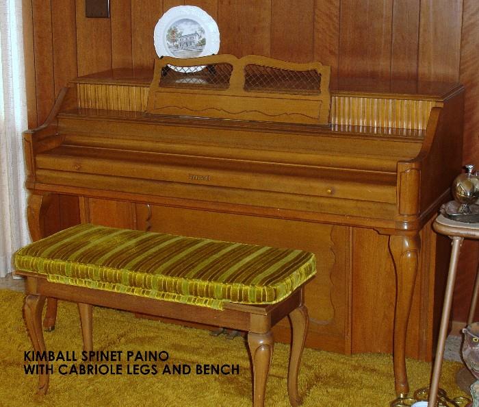 Kimball spinnet piano with bench and sheet music