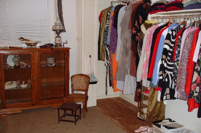 Curio cabinet, child's chair and women's clothing