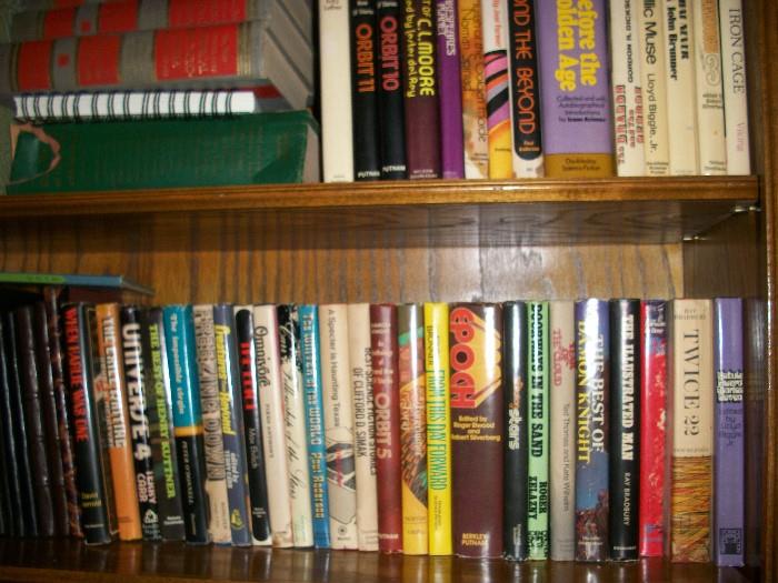 Four shelves filled with Hard cover (including jackets) of Science Fiction--INTERESTING JACKET ART