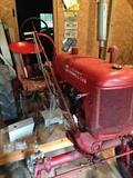 1948 Farmall Cub with like new Woods mower, single bottom plow and front blade.