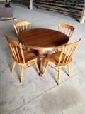 round oak table and 2 leaves with complete set of linens. 4 dining chairs are maple.