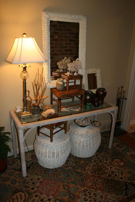 Wicker frame mirror, wicker & glass top console table, pair of wicker storage baskets, set of bamboo stools, Raku pottery, coral