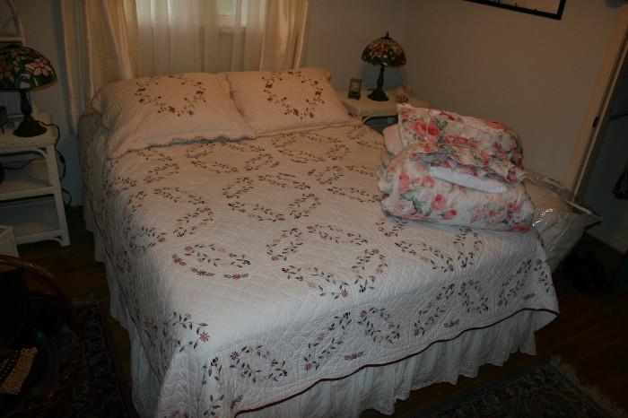 Queen size bed, pair of wicker end tables, pair of Tiffany style lamps, comforter set