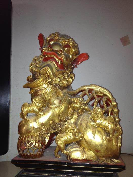 Large and beautifully carved gilt foo dogs pair