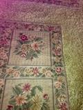 There are 2 chain stitch embroidered rugs approx. 9x12