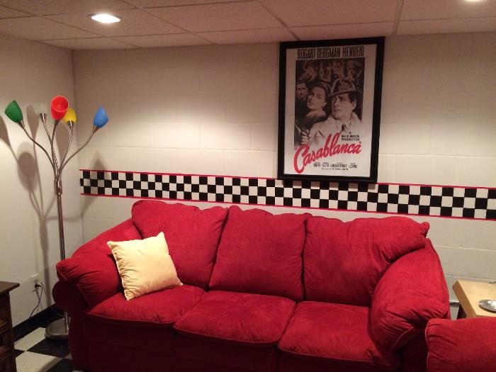 One if two red sofas; retro floor lamp, Casablanca framed picture
