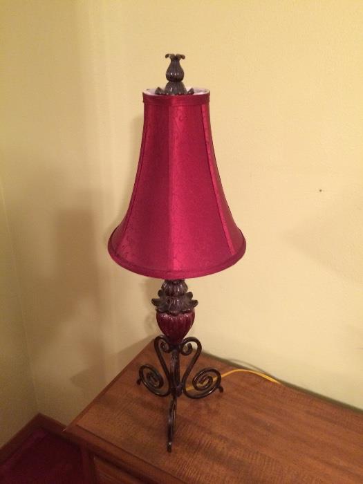 Two lamps with red shades