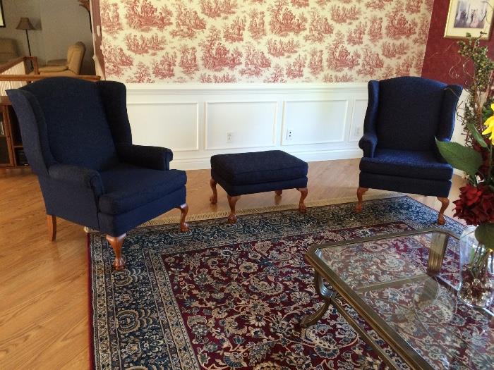 2 sets - each set includes two claw-footed Victorian dark blue chairs and one ottoman 