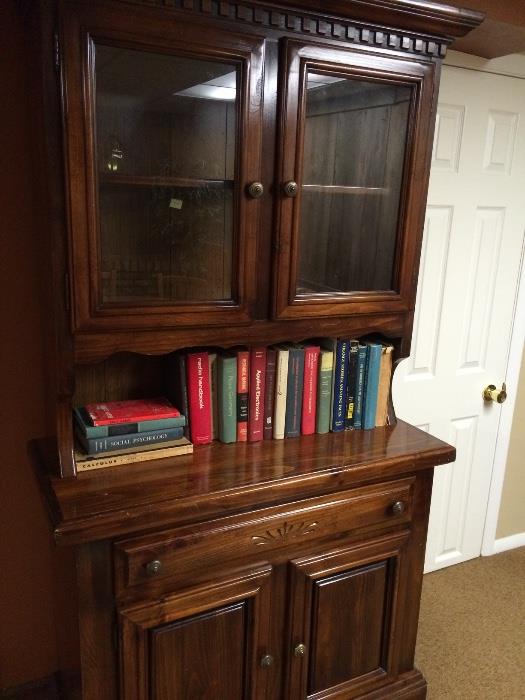 Lighted glass door hutch and vintage college text books