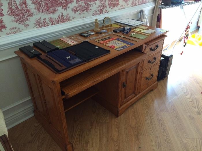 Oak computer desk, briefcases, misc. office supplies.