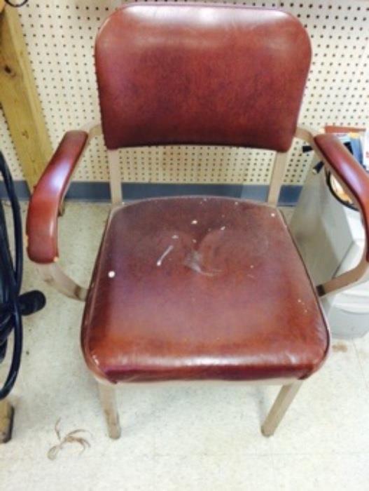 Two vintage office arm chairs
