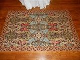Dining Room:  Needlepoint rug measures  4' x 6'.