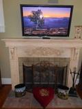 Hearth Room:  The 50" PANASONIC flat screen TV; English hunt scene theme waste baskets; vintage heart-shaped needlepoint ottoman; fireplace tools.