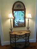 Living Room:  A painted console (36" wide x 15" deep x 28" tall) and a matching mirror (22" x 42") are sold as a set.  The two grey urn candlestick lamps (33" tall) are sold as a pair.