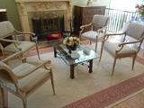 Hearth Room:  Four COUNCILL crackle-finish chairs; a Chinoiserie coffee table with glass top; a large natural/terracotta rug.