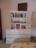 Bedroom 3:  A six-drawer dresser with removable hutch from "Bellini;"  books; accessories.