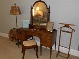 Bedroom #2:  A vintage vanity; chair; vintage floor lamp; valet.