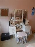 Bedroom #3:  Triple mirror vanity; colorful stool; Paris-theme decor.