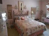 Bedroom #3:  An overview of this fun room which includes the iron queen size headboard; mattress set; linens and decor!.