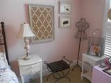Bedroom #3:  A two-drawer night stand; lamp; bench; bulletin board; wire dress form; a one drawer night stand; and more!