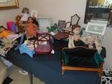 Bedroom #1:  A collection of AMERICAN GIRL dolls and books as well as some doll furniture.  You can see doll Kirsten in the left corner.  We also have some of her accessories and a collection of books.