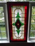 Music Room:  A framed stained glass piece of art that hangs on chains.  It measures  53" tall x 25" wide.  