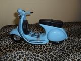 Living Room:  So, you always wanted a Vespa???  Here's one for you:  a cute little power blue die cast model.