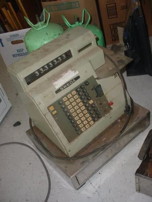 One of the several cash registers, old adding & calculator machines