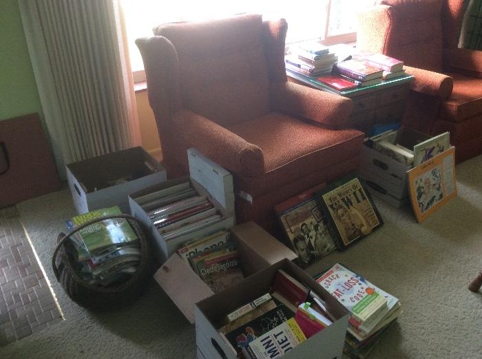 BOOKS, MAGAZINES, RETRO ORANGE CHAIR=THERE IS A PAIS
