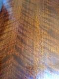 Close up of grain of African mahogany on piano 