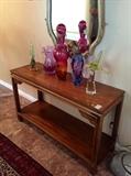 Campaign style burlwood console, Murano glass figurines and vases from Italy 