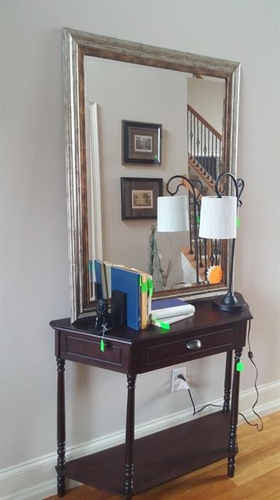 Foyer table, mirror and accessories.