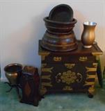 Wood chest with brass accents and lock.