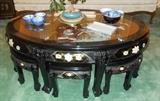 Asian black lacquer oval coffee table with 6 stools.