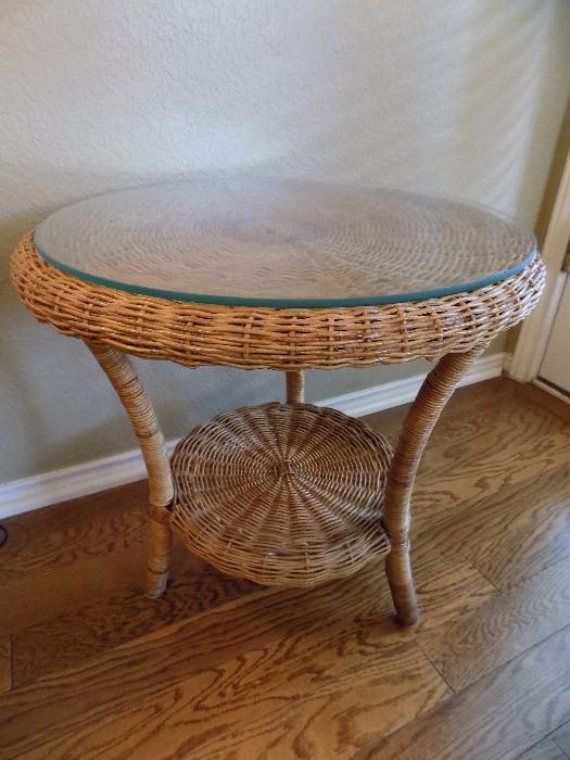 vintage wicker table with glass top...one of pair