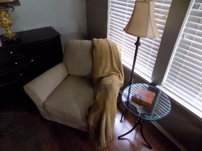beige chair with throw