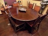 antique dining table showing leaf and all 6 chairs